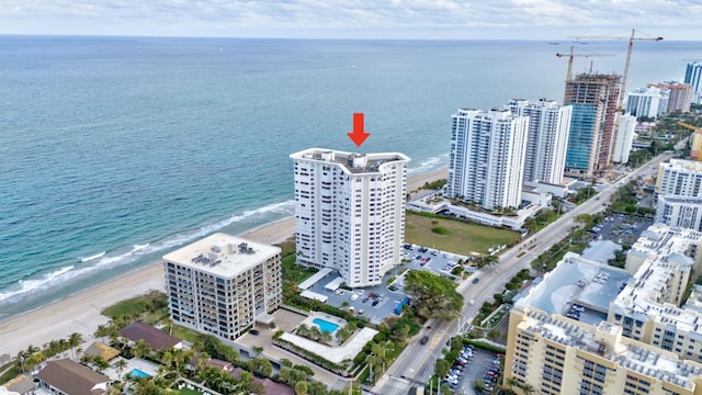 aerial view with a water view and a view of the beach