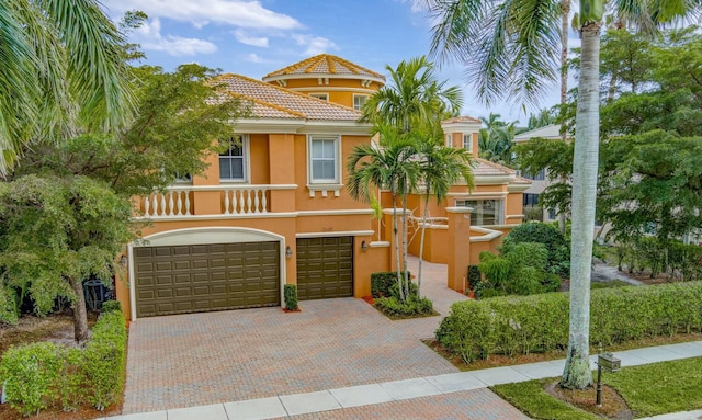 mediterranean / spanish house with a garage