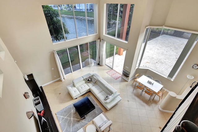 tiled living room with a high ceiling