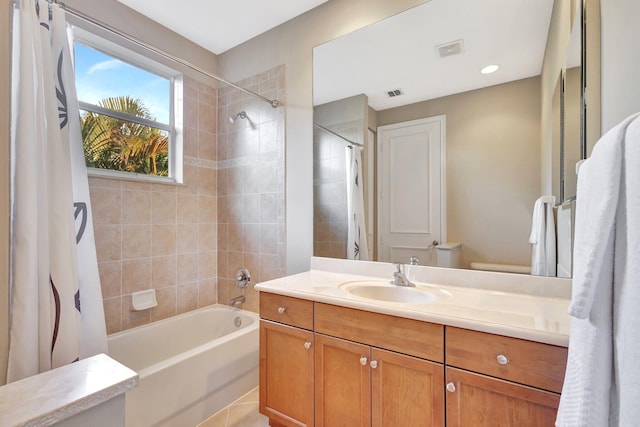 full bathroom with toilet, vanity, shower / bath combo, and tile patterned flooring