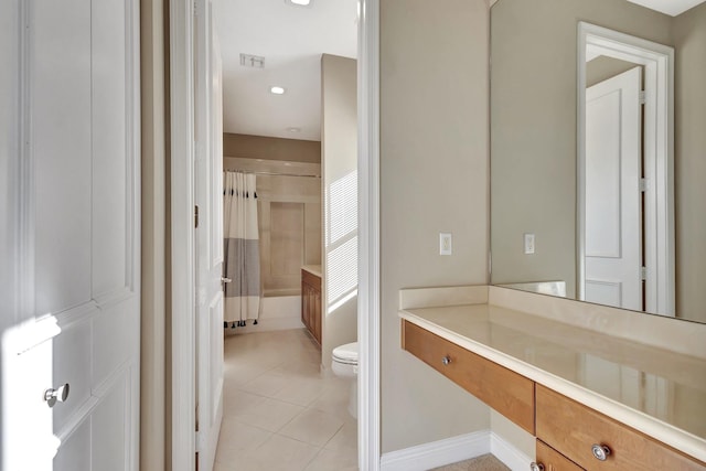 full bathroom featuring toilet, vanity, tile patterned flooring, and shower / bath combination with curtain