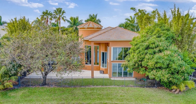 rear view of house with a lawn