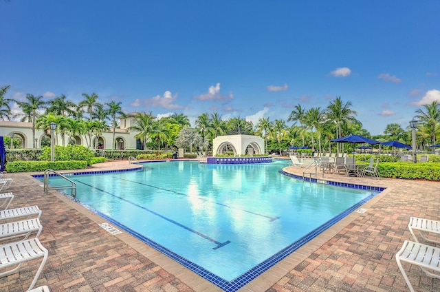 view of swimming pool with a patio area