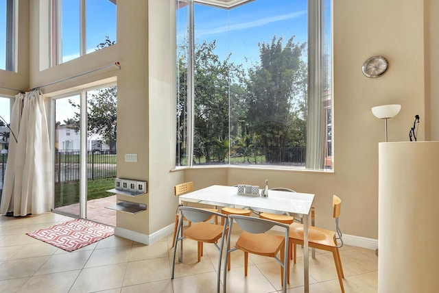 dining area featuring light tile patterned floors and a wealth of natural light