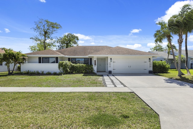 single story home featuring a front lawn and a garage