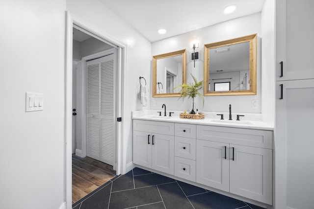 bathroom with vanity and tile patterned floors