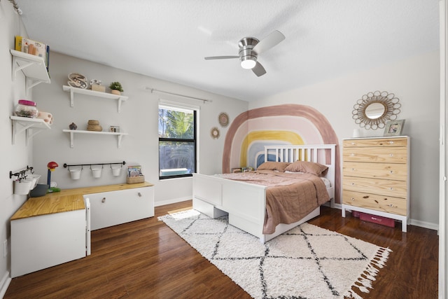 bedroom featuring ceiling fan and dark hardwood / wood-style floors