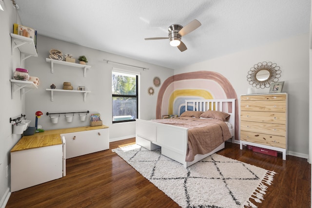 bedroom featuring ceiling fan and dark wood-type flooring