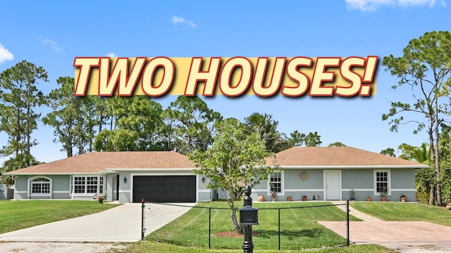 view of front of house featuring a front yard and a garage