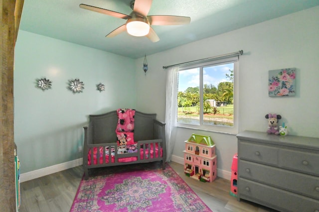 bedroom featuring ceiling fan and light hardwood / wood-style floors