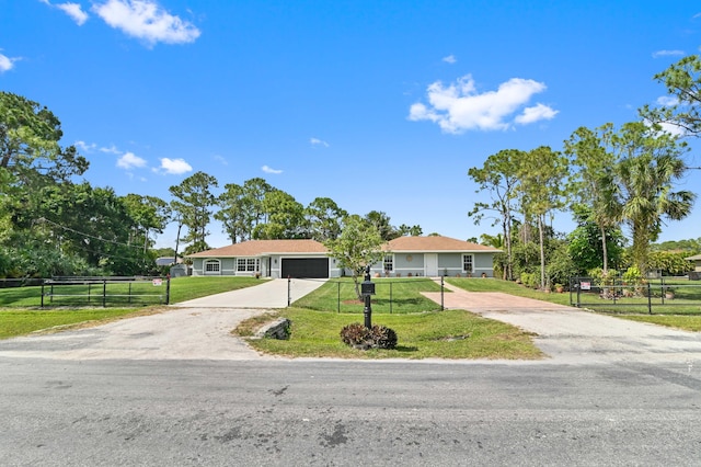 single story home with a front lawn and a garage