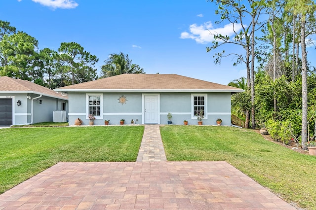 rear view of house featuring a lawn