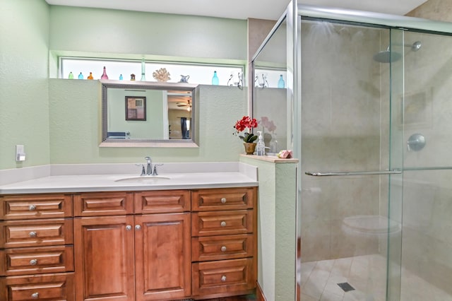 bathroom with an enclosed shower and vanity