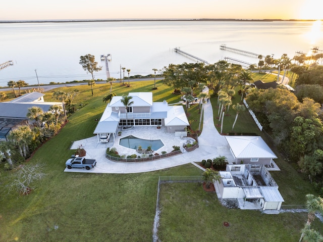 aerial view at dusk with a water view