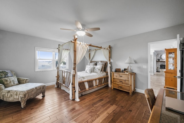 bedroom featuring dark wood-type flooring and ceiling fan