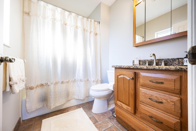 full bathroom with toilet, vanity, and shower / tub combo