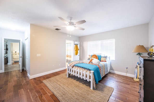 bedroom featuring ceiling fan and dark wood-type flooring