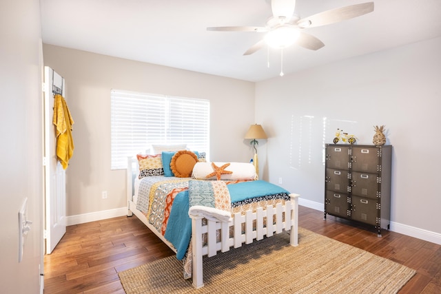 bedroom featuring dark wood-type flooring and ceiling fan