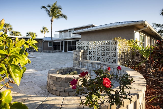 view of patio / terrace featuring a fire pit