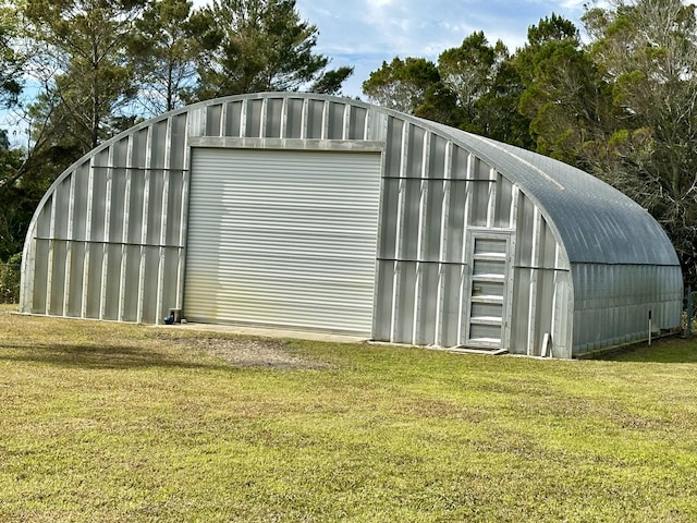 view of outdoor structure with a lawn