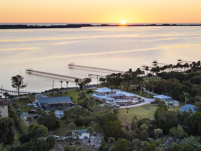 aerial view at dusk with a water view