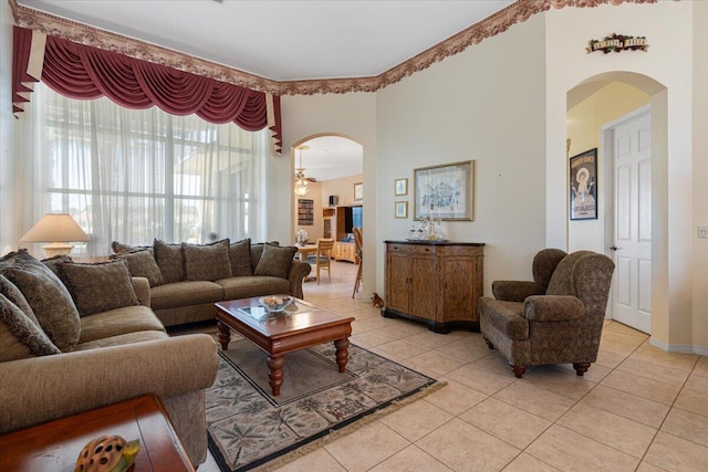 living room with ceiling fan and light tile patterned floors