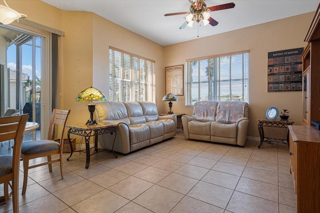 living room with ceiling fan and light tile patterned floors