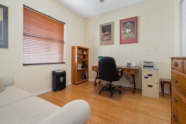 home office with ceiling fan and light wood-type flooring