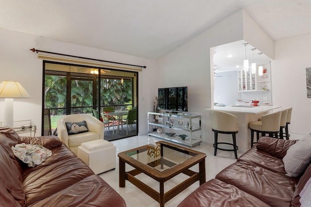 tiled living room featuring lofted ceiling and ceiling fan