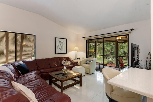 tiled living room with lofted ceiling