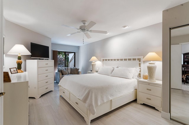 bedroom with ceiling fan and light hardwood / wood-style floors