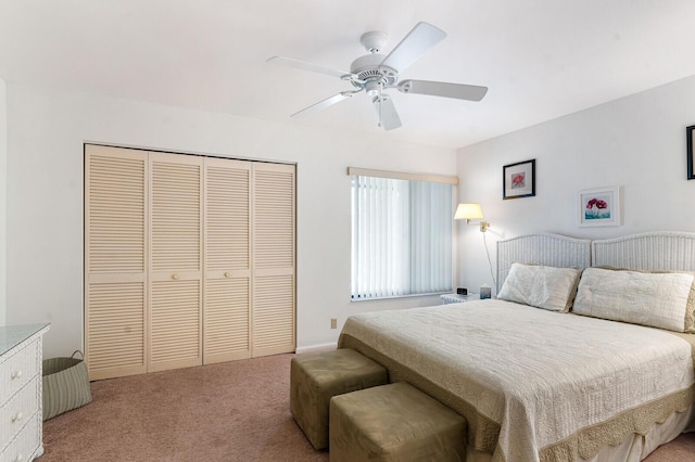 bedroom with a closet, ceiling fan, and carpet