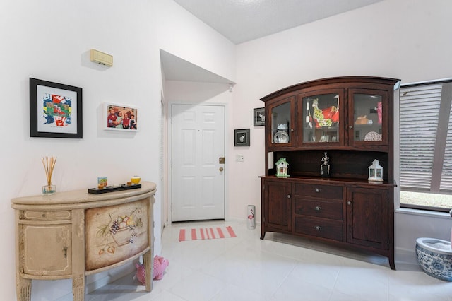 foyer featuring light tile patterned flooring