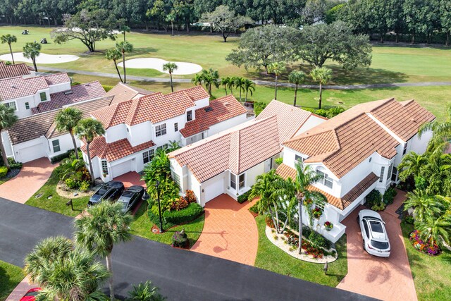 mediterranean / spanish-style house with a garage