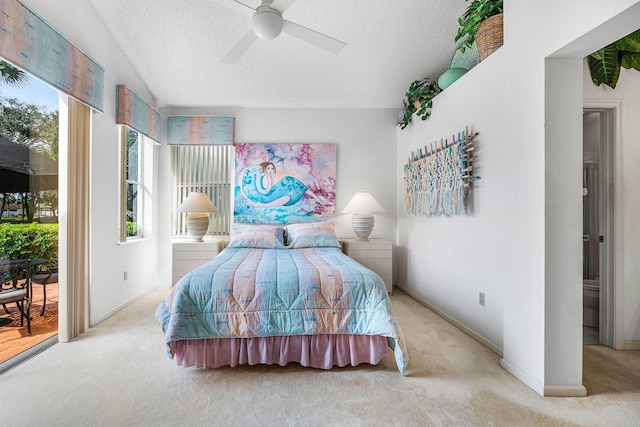 bedroom with light carpet, access to outside, and a textured ceiling