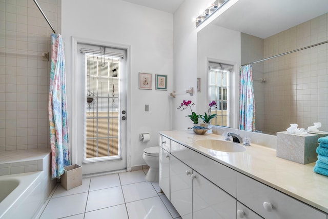 bathroom with vanity, toilet, and tile patterned flooring