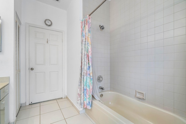 bathroom featuring shower / tub combo with curtain, vanity, and tile patterned flooring