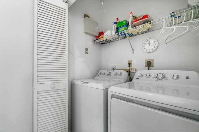 clothes washing area featuring washer and clothes dryer