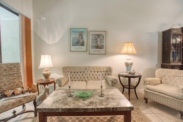 living area with light tile patterned flooring and a healthy amount of sunlight