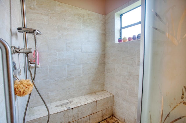 full bathroom with tiled shower
