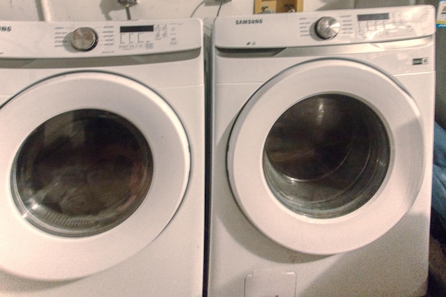 washroom featuring independent washer and dryer and laundry area