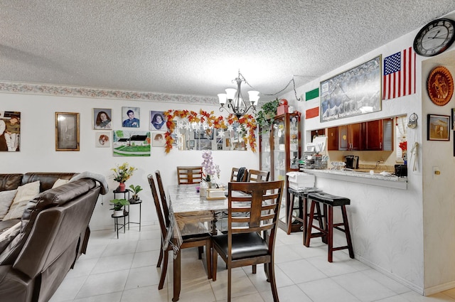 dining room featuring a notable chandelier, a textured ceiling, and light tile patterned flooring