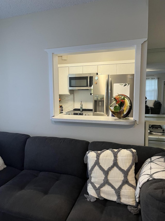 living room featuring a textured ceiling