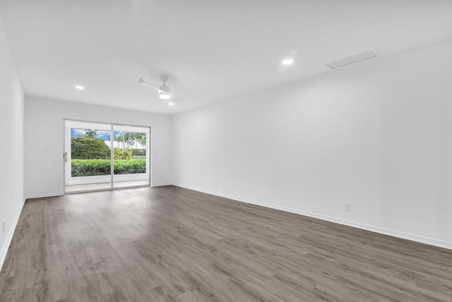 empty room featuring hardwood / wood-style floors and ceiling fan