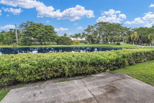 surrounding community featuring a water view