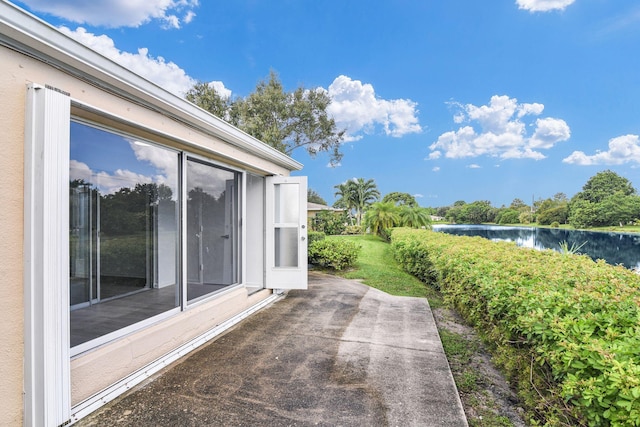 view of patio / terrace featuring a water view