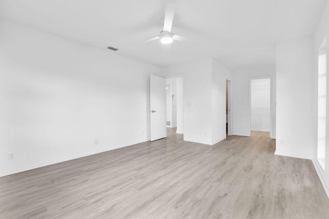 empty room featuring light wood-type flooring and ceiling fan