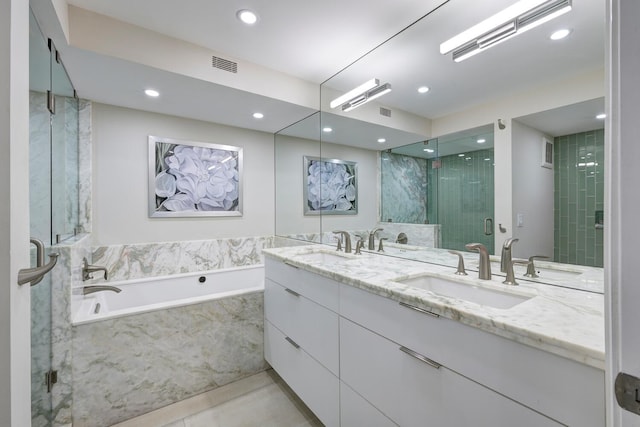 bathroom with plus walk in shower, tile patterned floors, and vanity