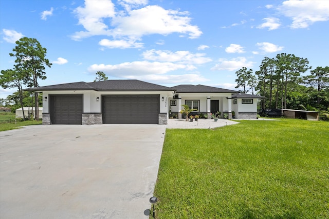 prairie-style house with a front lawn and a garage