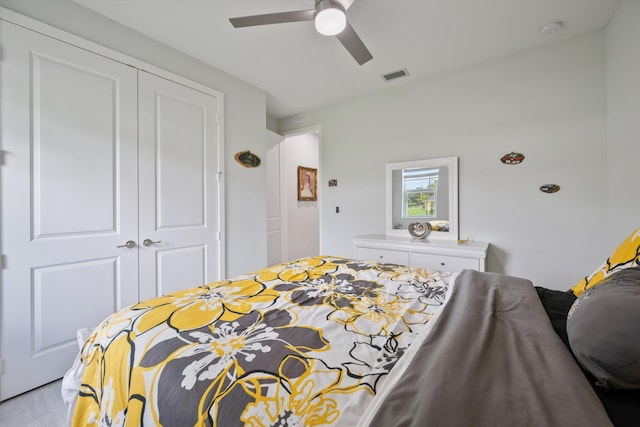 bedroom featuring a closet, ceiling fan, and light wood-type flooring